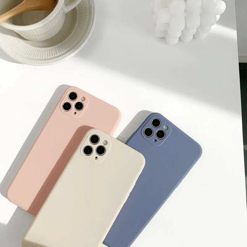 Slim solid colour silicone phone case for iPhone on a flat surface.