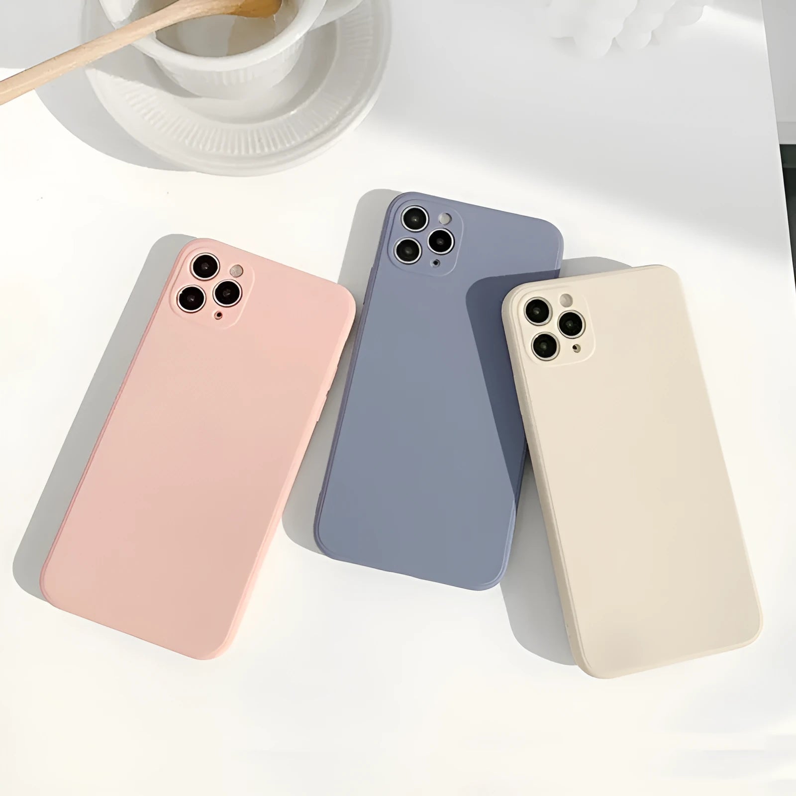 Slim solid colour silicone phone case for iPhone on a flat surface.