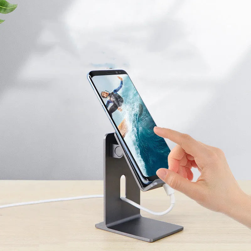 Alloy metal lazy bracket mobile phone holder on a desk, holding a smartphone.