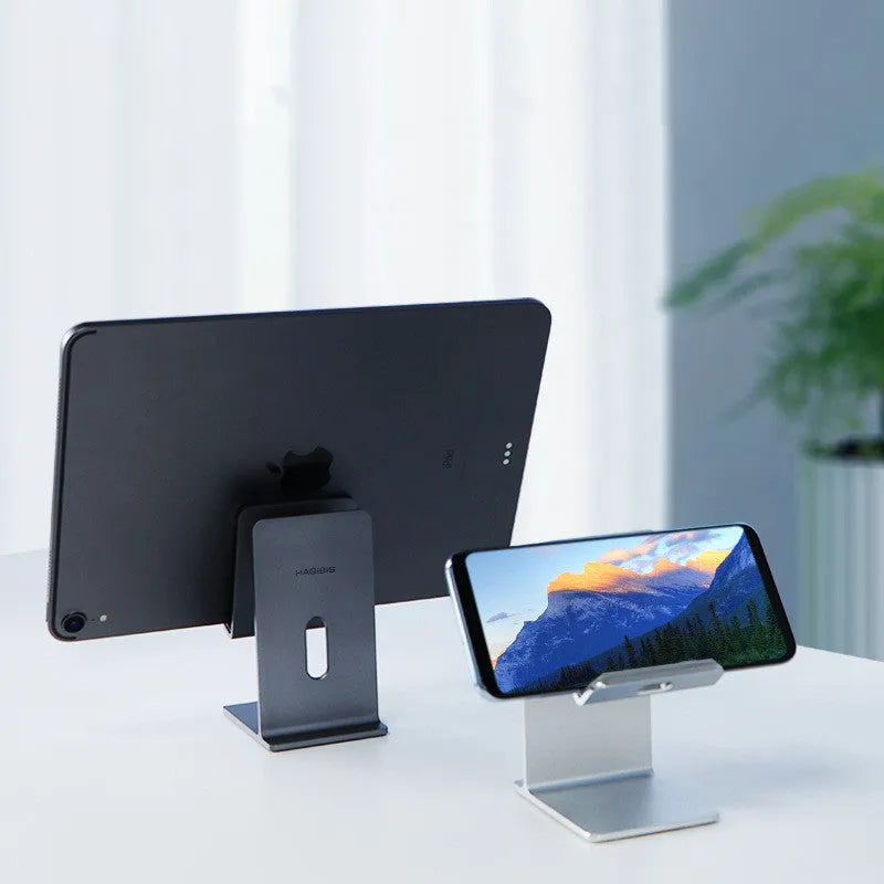 Alloy metal lazy bracket mobile phone holder on a desk, holding a smartphone.