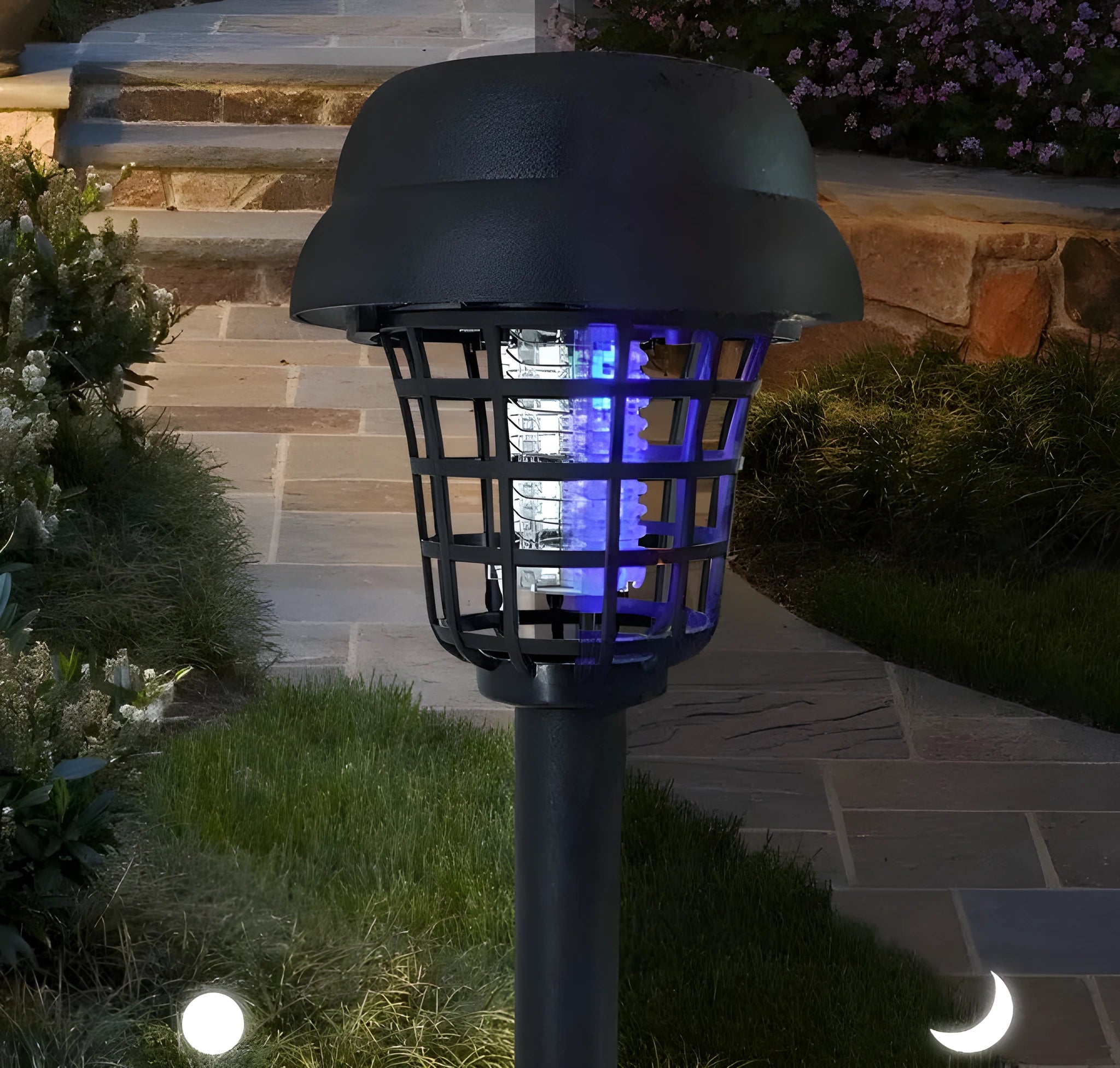 Small white and purple solar-powered mosquito killer lamp for outdoor garden use.