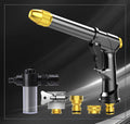 Extended all-metal telescopic garden hose with multi-spray water gun and foam attachment on lawn.