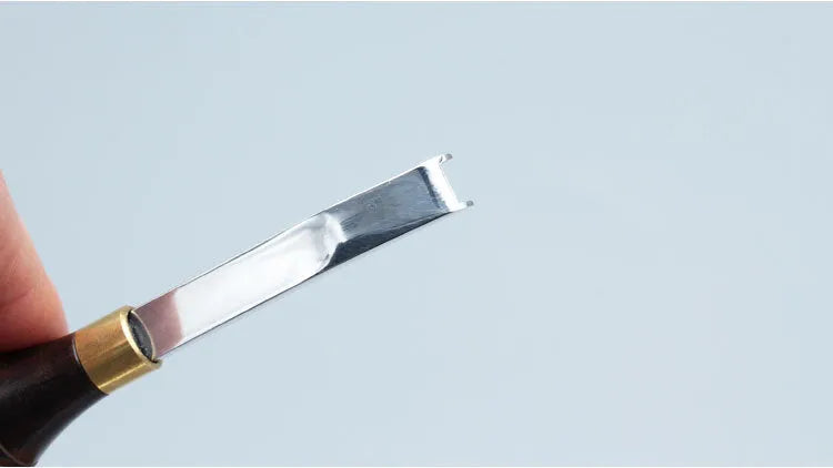 Leather hand tools kit with sectional cutting knife and wide shovel edge thinner for skiving.