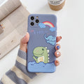 Blue frosted soft shell iPhone case with cartoon dinosaur print next to pink case with cat girl print.