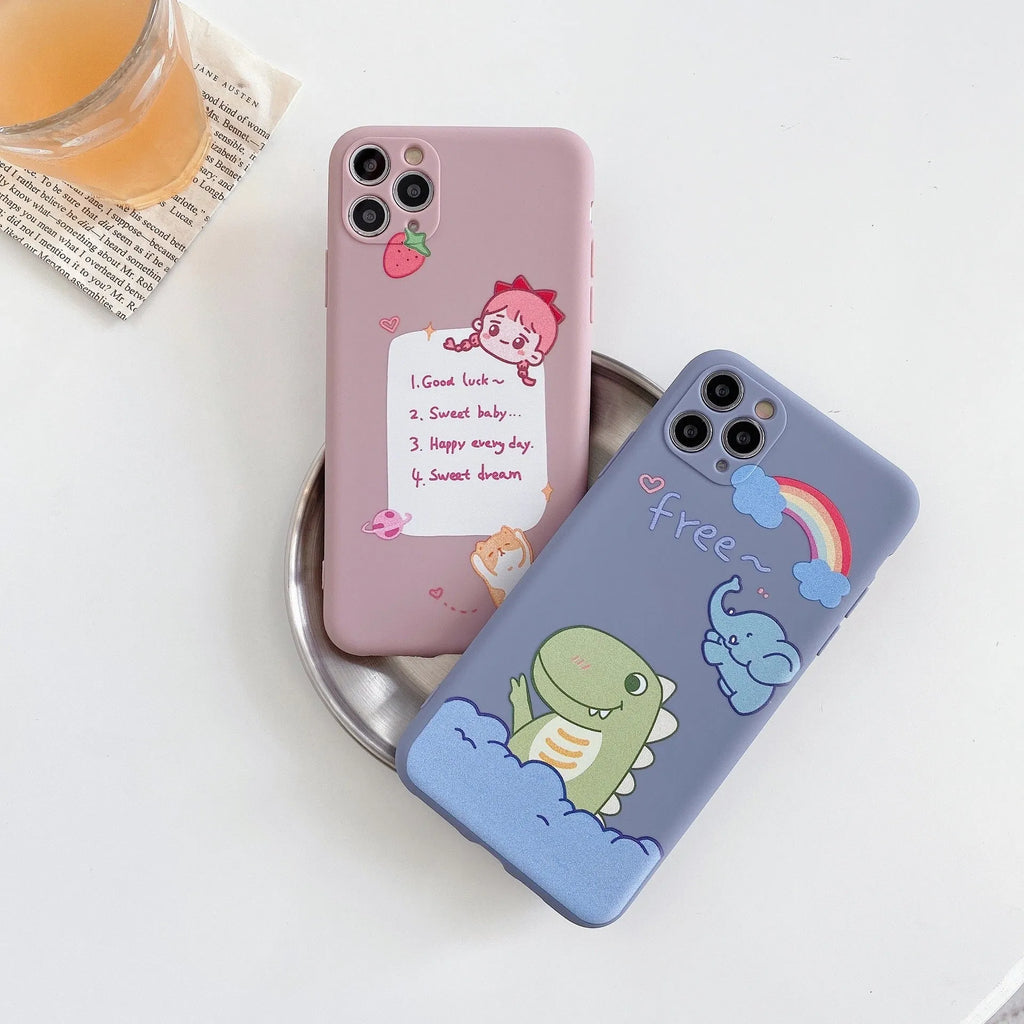 Blue frosted soft shell iPhone case with cartoon dinosaur print next to pink case with cat girl print.