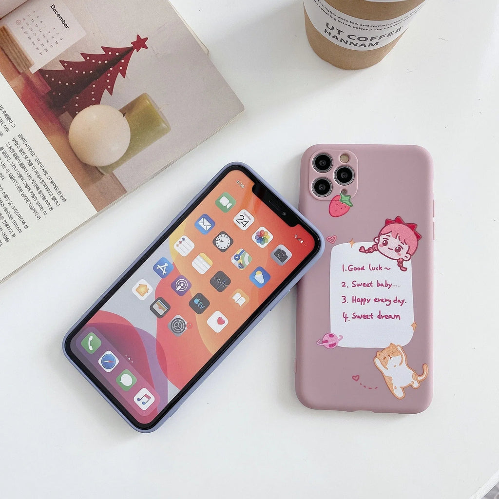 Blue frosted soft shell iPhone case with cartoon dinosaur print next to pink case with cat girl print.