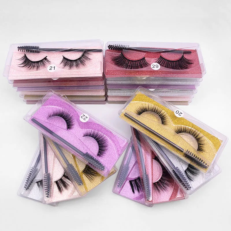 Pair of natural 3D false eyelashes with imitation mink fibres, plastic cotton thread stem, and included brush