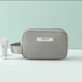 Nylon cube cosmetic bag in blue with sealed closure, available in large and small sizes for travel makeup storage