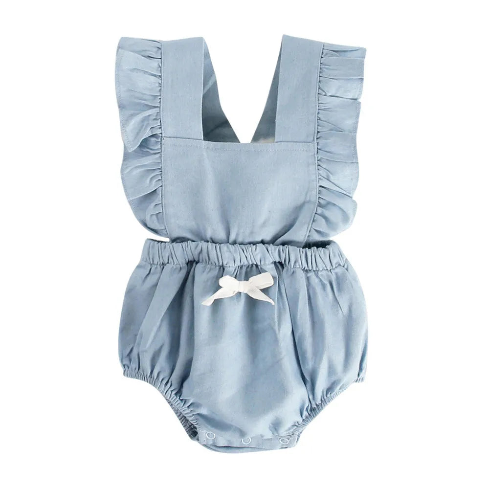 Blue denim sleeveless baby romper with lace trim on a hanger