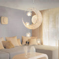 Aluminium wire star and moon design chandelier with adjustable hanging height.