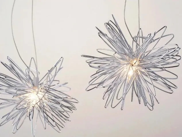 Aluminium wire star and moon design chandelier with adjustable hanging height.