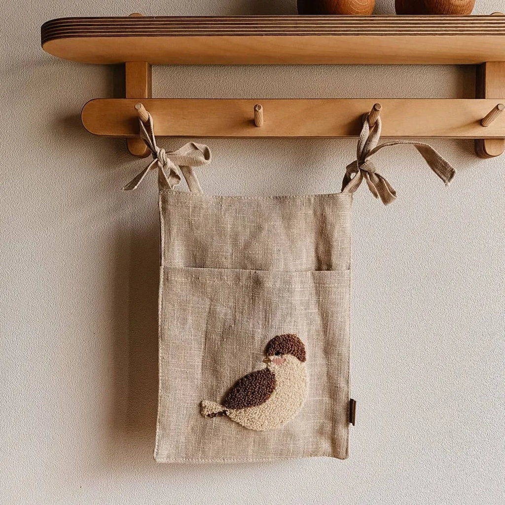 Khaki cotton linen hanging bedside storage bag with a single pocket.
