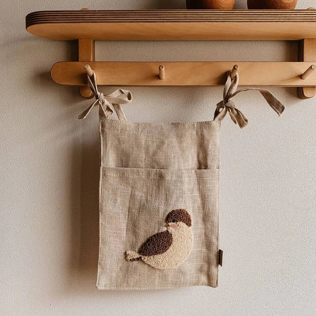 Khaki cotton linen hanging bedside storage bag with a single pocket.