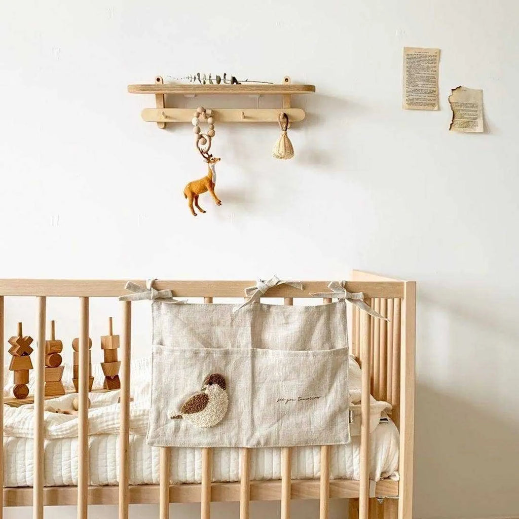 Khaki cotton linen hanging bedside storage bag with a single pocket.