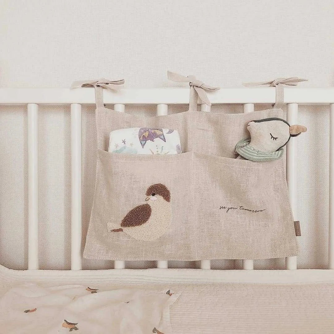 Khaki cotton linen hanging bedside storage bag with a single pocket.