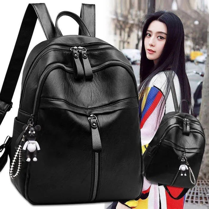 Black soft pu leather backpack with double straps, shown open to reveal internal ID bag compartment.