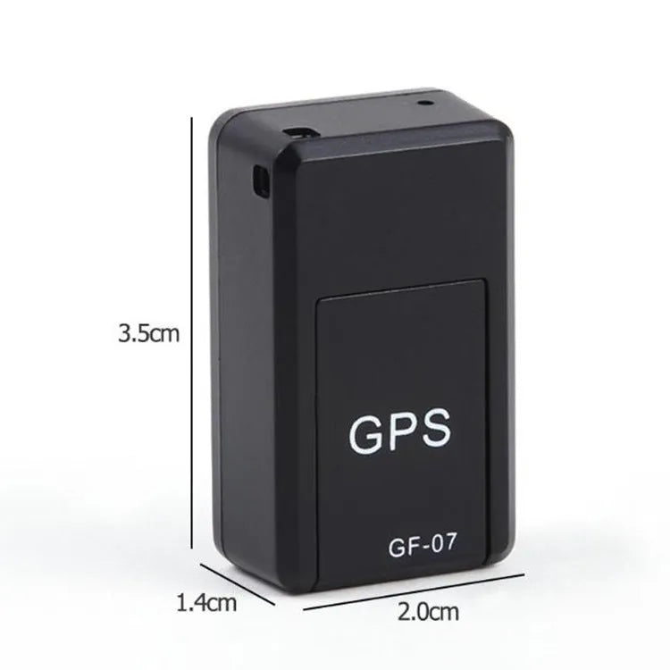 Small black plastic magnetic GPS car tracker device with USB cable.