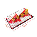Red RC parallel charging adapter board with four battery ports, safety fuses, and gold connectors.