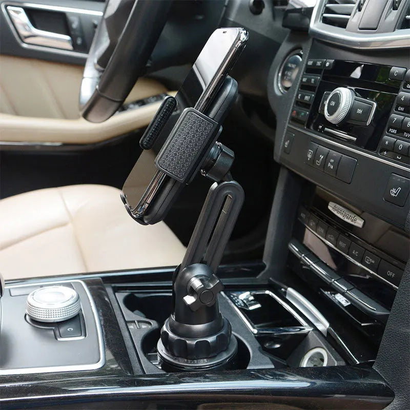 Black 360-degree rotating adjustable car phone holder with quick-release buckle and foam padding.