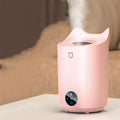 Coral Pink USB-powered humidifier and aroma diffuser with three mist outlets on a wooden table.