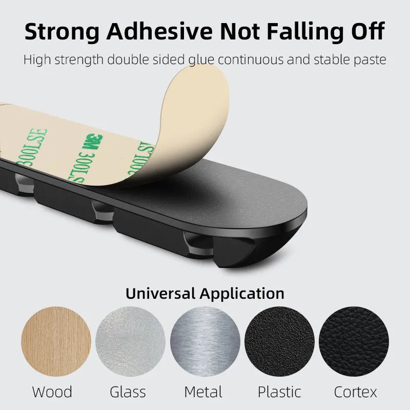 Black magnetic desktop charging cable organiser with soft plastic construction for cable storage