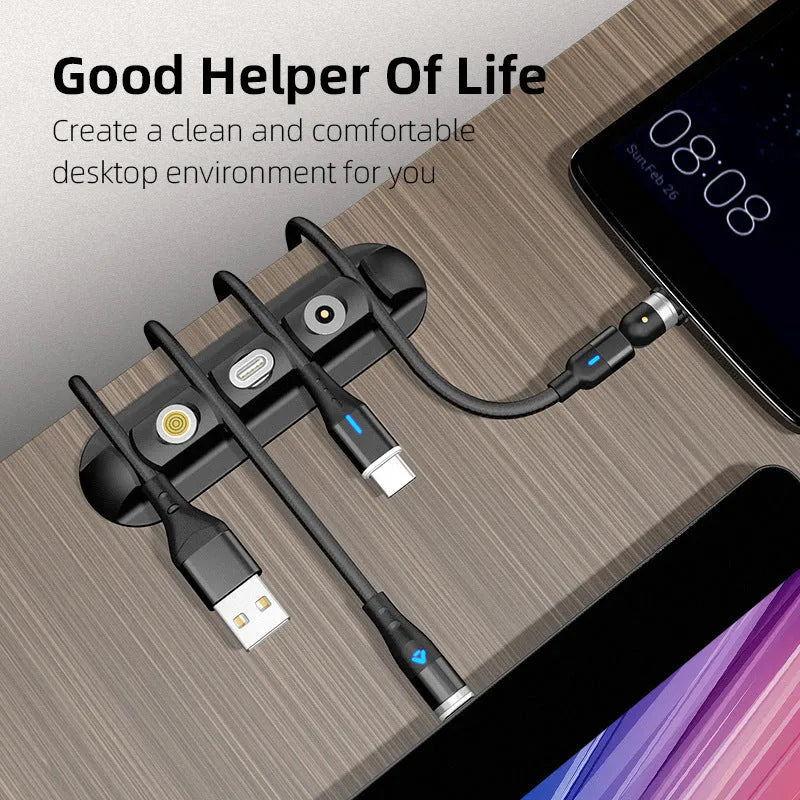 Black magnetic desktop charging cable organiser with soft plastic construction for cable storage