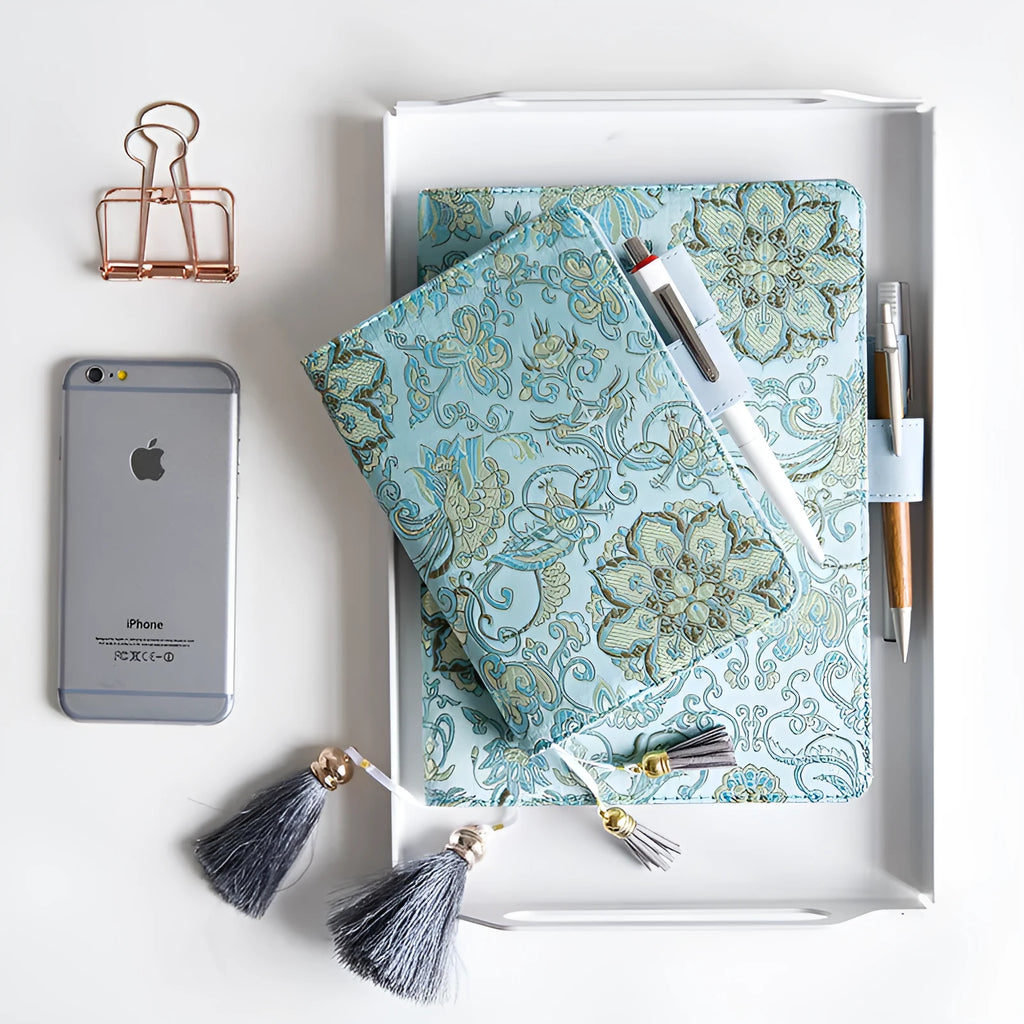 Flying Blue Flower fabric notebook in A5 and A6 sizes on a table.