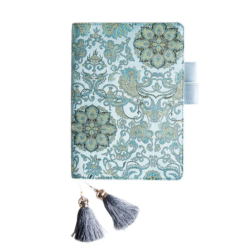 Flying Blue Flower fabric notebook in A5 and A6 sizes on a table.