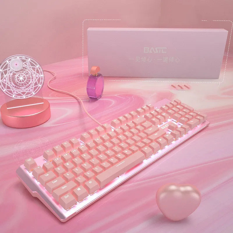 Pink coloured mechanical keyboard and wired mouse set on a desk.