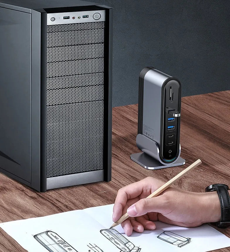 Deep space grey 16-in-1 USB-C laptop docking station with multiple ports on a desk.