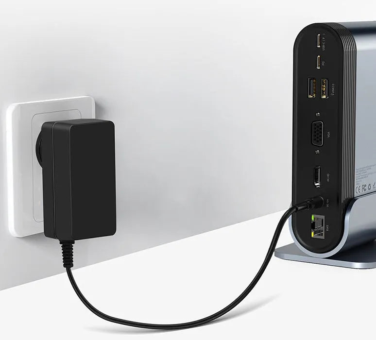 Deep space grey 16-in-1 USB-C laptop docking station with multiple ports on a desk.