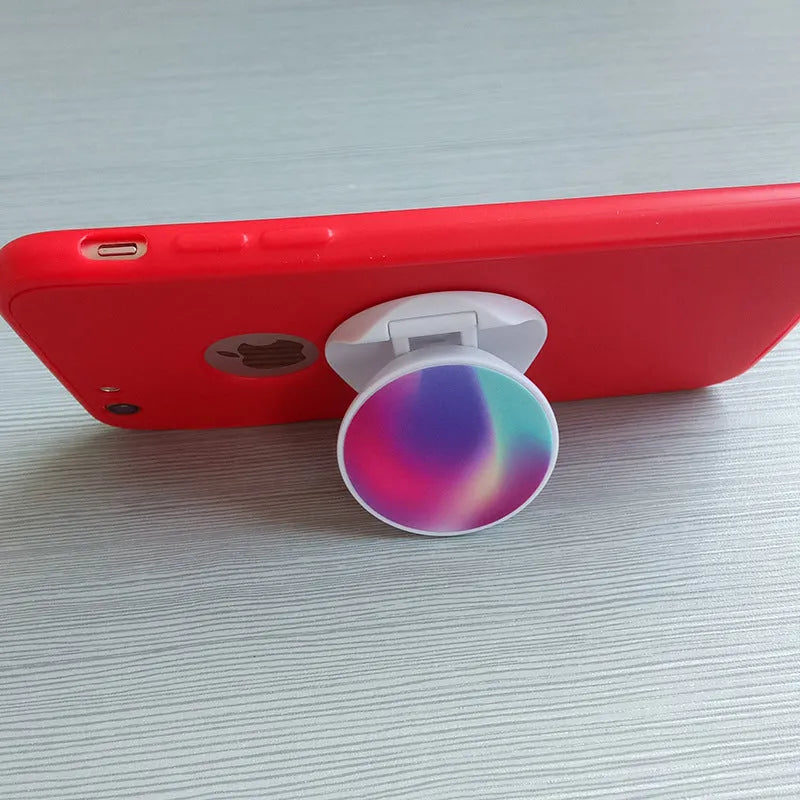 Folding mobile phone holder in solid colour with thermal transfer aluminium sheet option on desktop