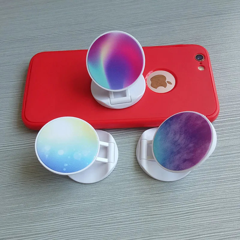Folding mobile phone holder in solid colour with thermal transfer aluminium sheet option on desktop