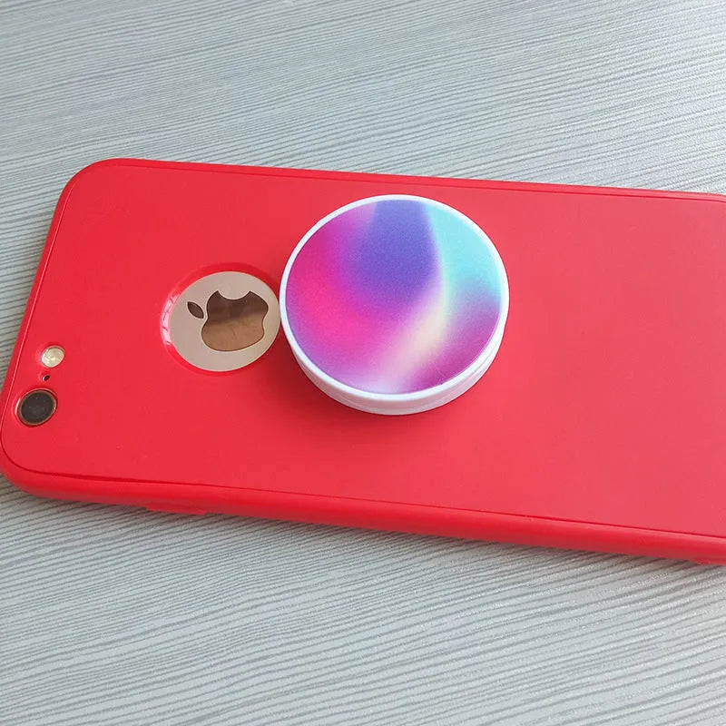 Folding mobile phone holder in solid colour with thermal transfer aluminium sheet option on desktop