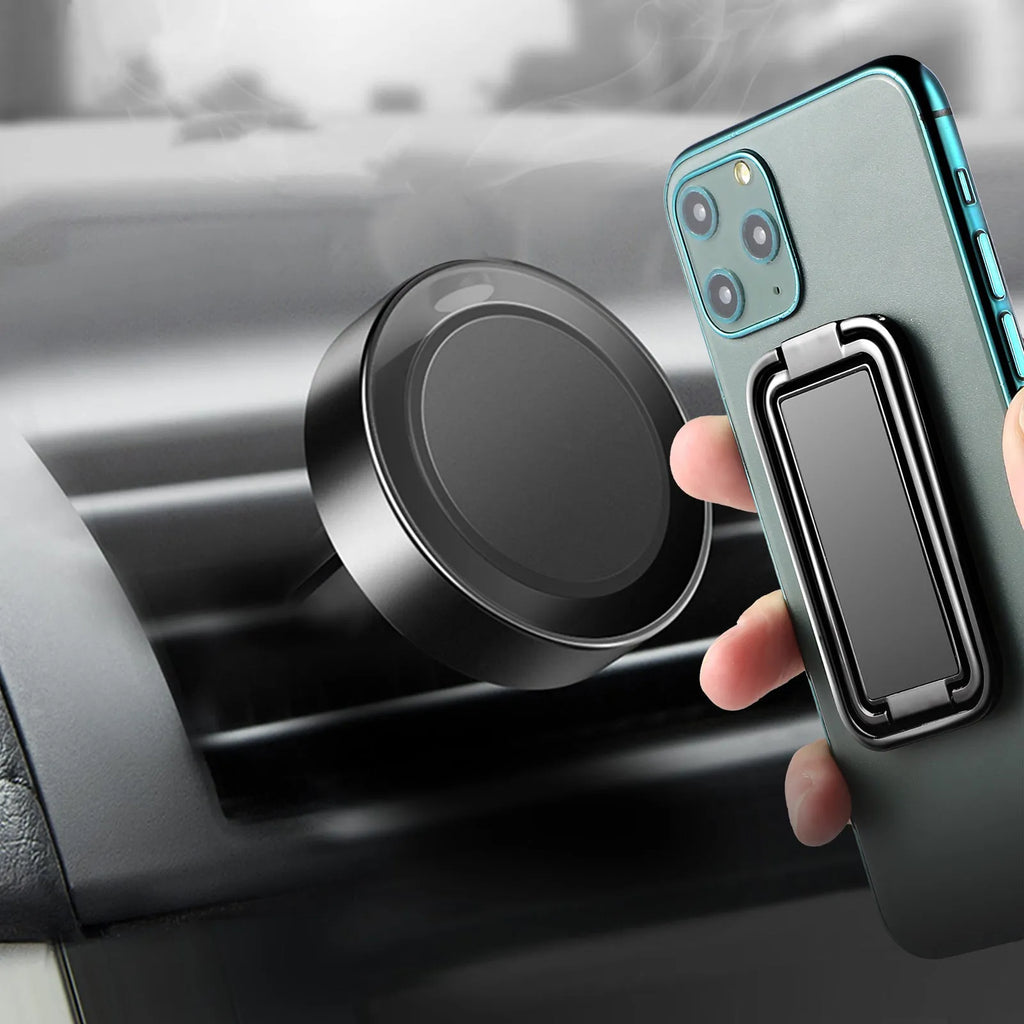 Folding double ring metal phone holder in silver with square buckle, open on a desk holding a smartphone