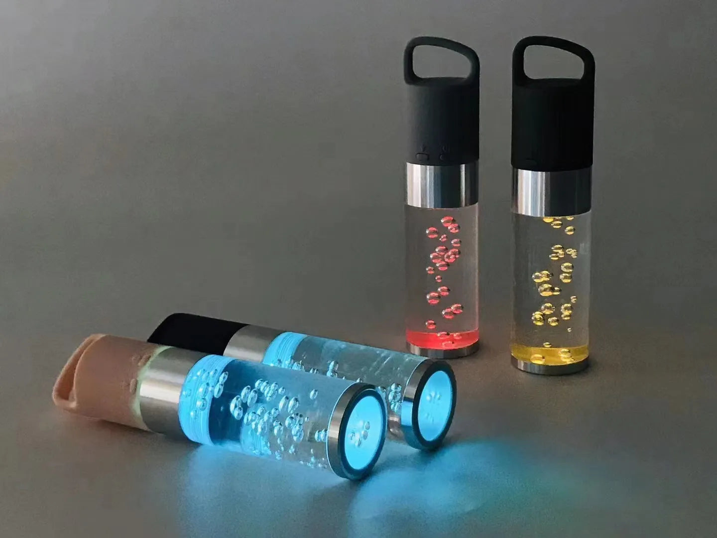 Small colourful Bluetooth speaker with decorative crystal light in pink, black, silver, or green.