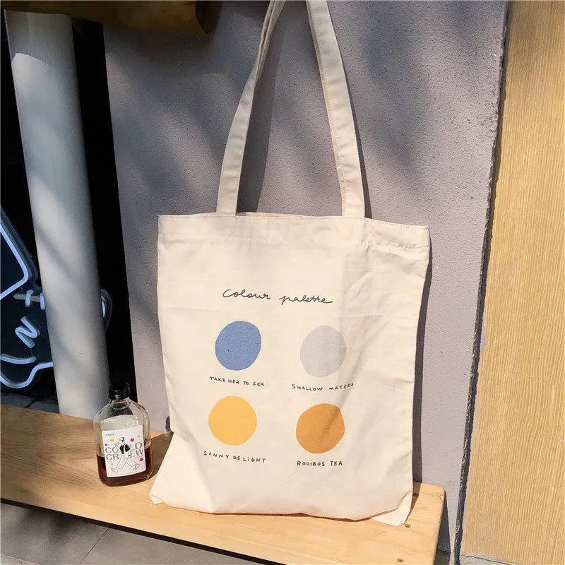 Women's medium canvas tote bag with zip closure and geometric pattern in light pink or orange