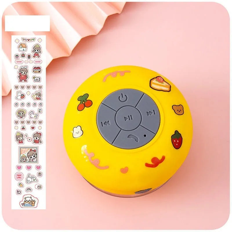 Small waterproof Bluetooth speaker with silicone suction cup base in five colour options
