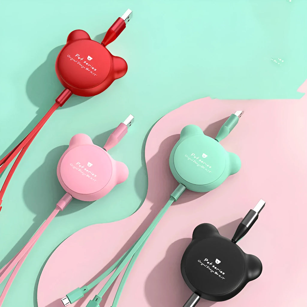 Cute bear-shaped cable organiser with three retractable data cables extended, showing Mini USB, Micro USB, and 30PIN connectors.