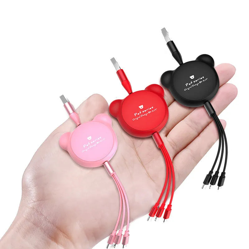 Cute bear-shaped cable organiser with three retractable data cables extended, showing Mini USB, Micro USB, and 30PIN connectors.