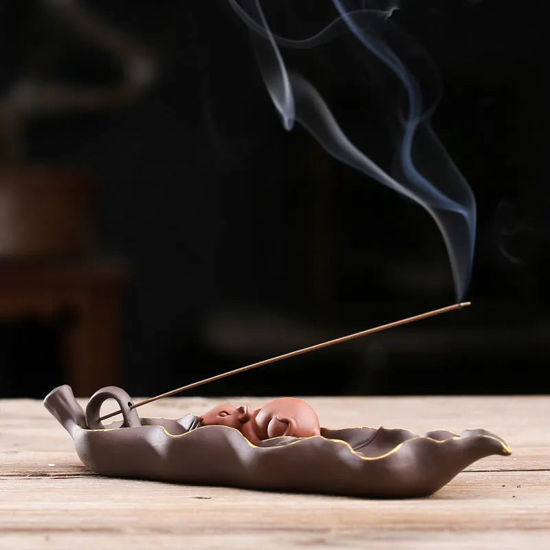 Dehua purple clay ceramic lying incense burner with gold rat design, 17 cm length