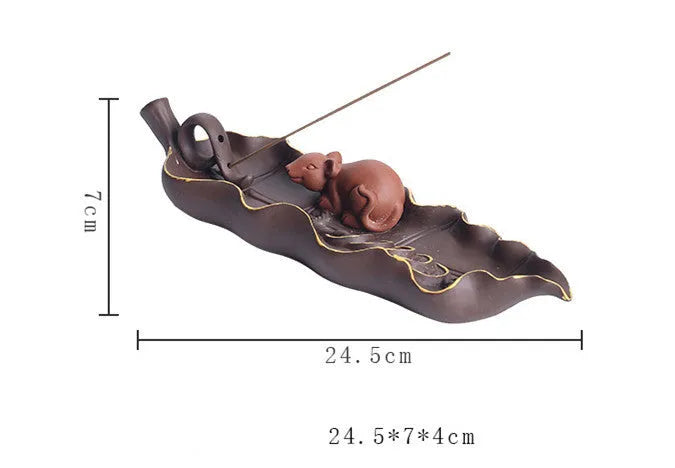Dehua purple clay ceramic lying incense burner with gold rat design, 17 cm length