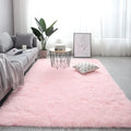 Nordic style rectangular plush carpet with anti-slip backing in beige colour on wooden floor