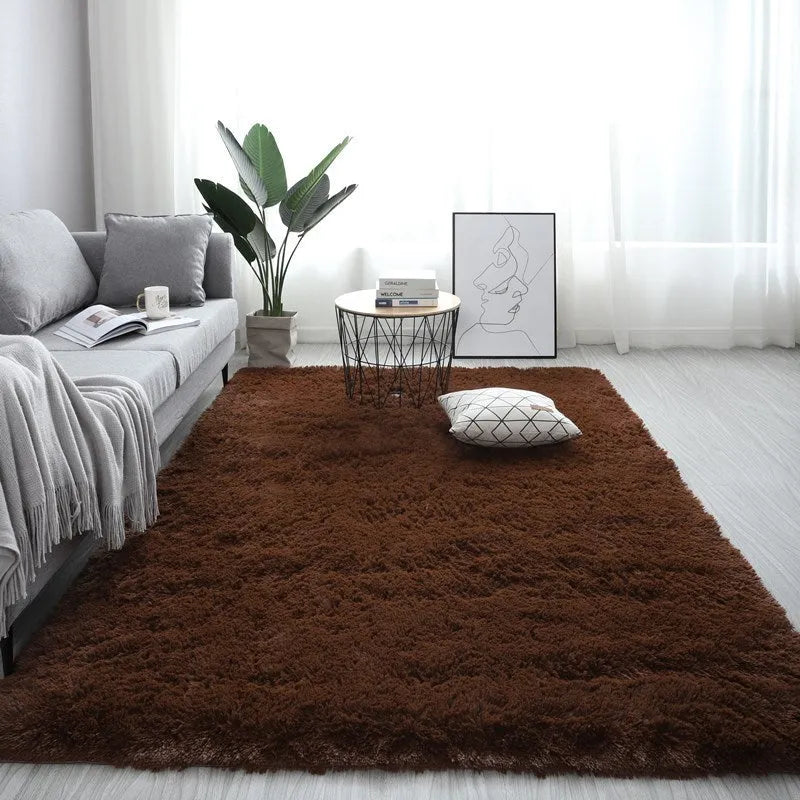 Nordic style rectangular plush carpet with anti-slip backing in beige colour on wooden floor