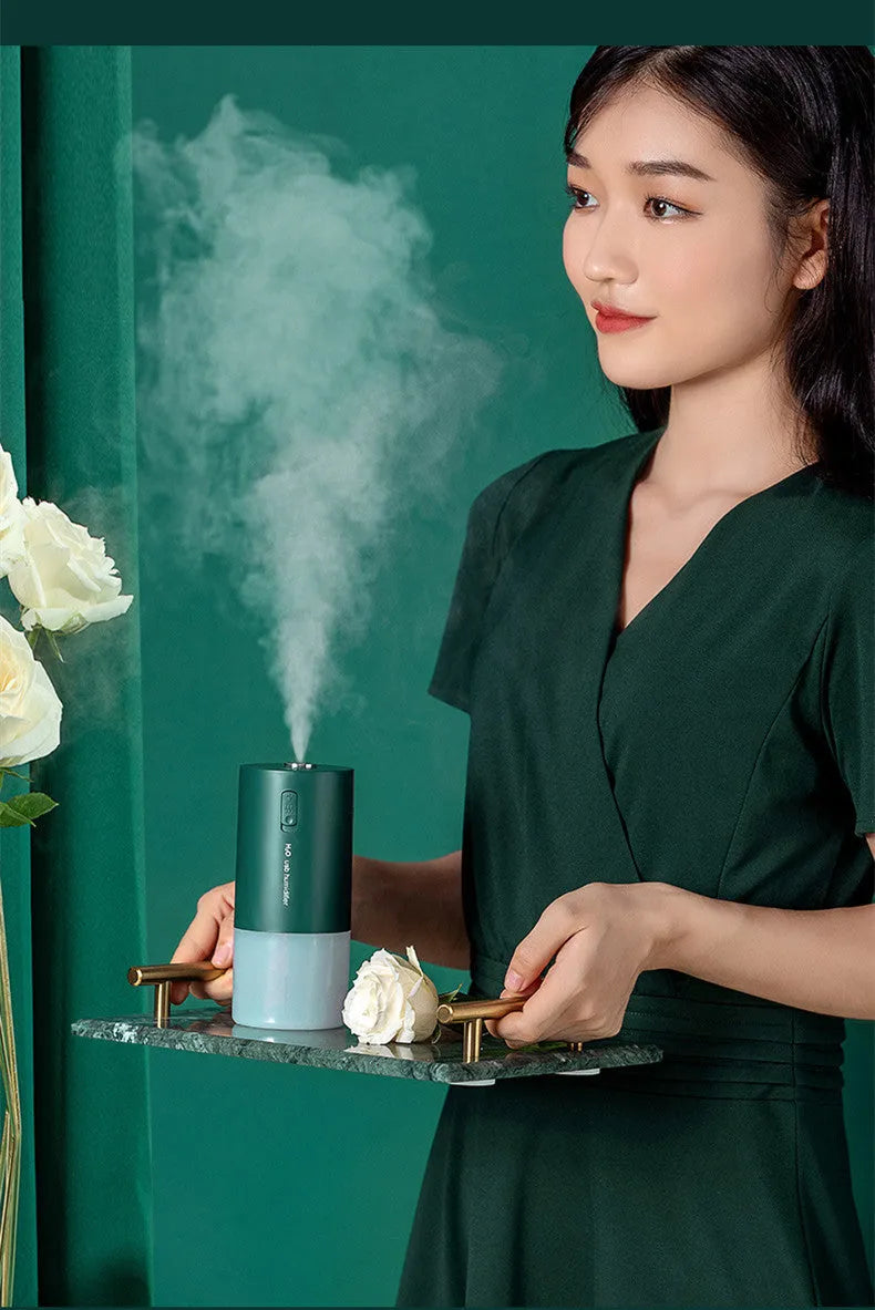 Blue columnar USB desktop humidifier with 1 litre water tank and aromatherapy function
