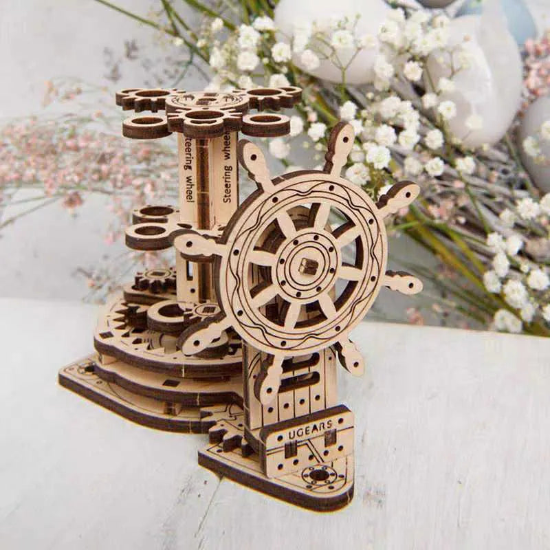 Ukrainian wooden steering wheel model rotating pen holder on a desk.