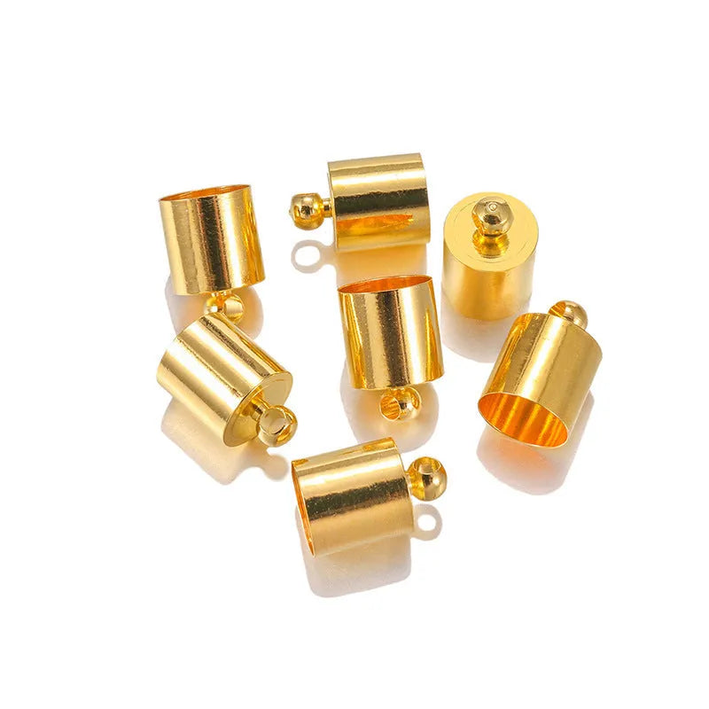 Assortment of multi-colour copper caps in gold, silver, black, and bronze finishes for jewellery making.