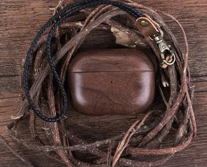 Solid wood protective sleeve for AirPods charging case in walnut finish with leather hand strap