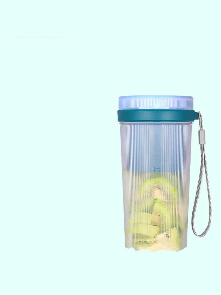 Pink and green portable electric juicer cup with USB charging port and round feeding lid.