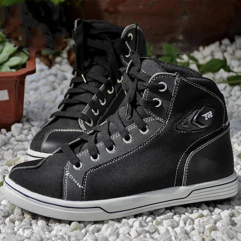 Men's black casual short motorcycle riding boots with a non-slip sole on a grey background.